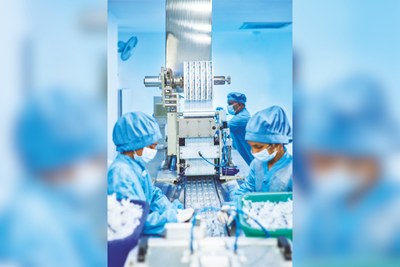 Operators at an automated production line